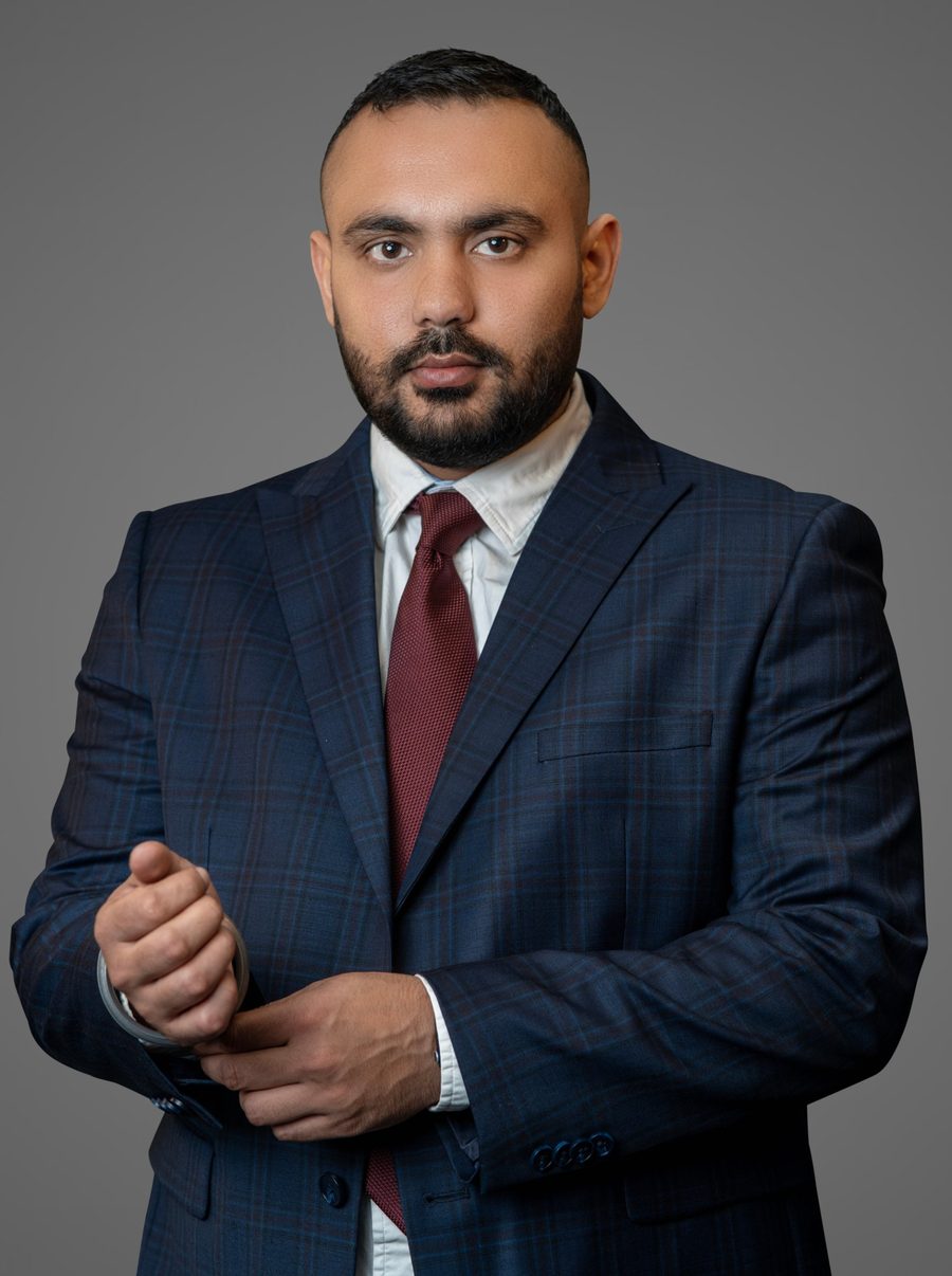 Taran Bains in a navy suit